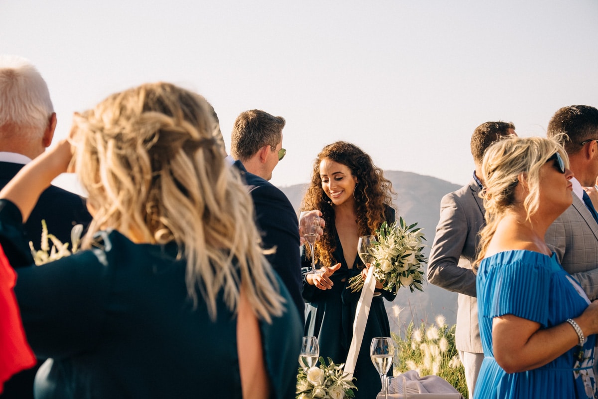 Santorini wedding guests after ceremony at Cavo Tagoo